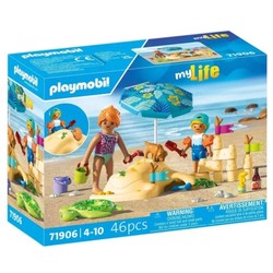 Juguetes construcción niños Playmobil en la playa