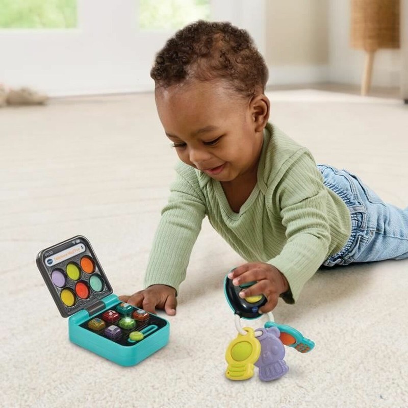 Bebé jugando con teléfono Vtech, bloques construcción infantiles