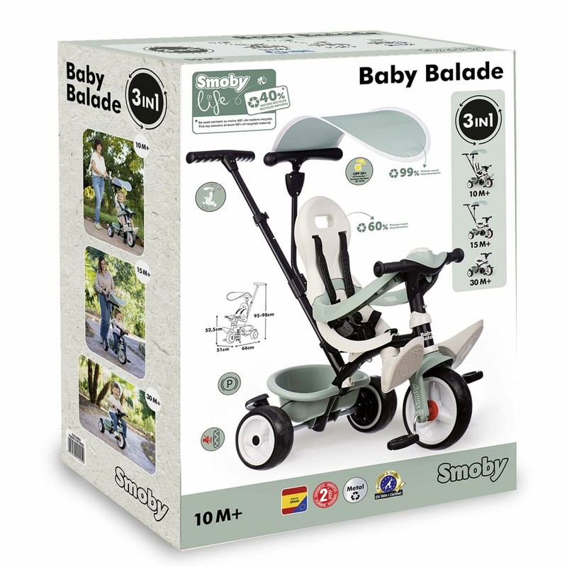 Niño feliz en triciclo Smoby, fomenta bloques construcción infantiles de habilidades