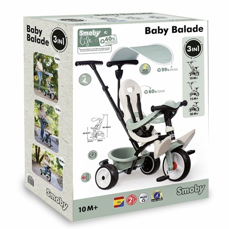 Niño feliz en triciclo Smoby, fomenta bloques construcción infantiles de habilidades