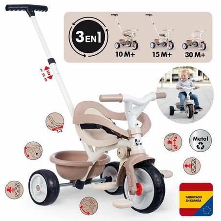 Triciclo infantil Smoby en un fondo neutro, destacando su color beige y detalles multicolor.