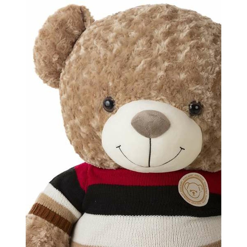 Oso de peluche para abrazar en habitación infantil