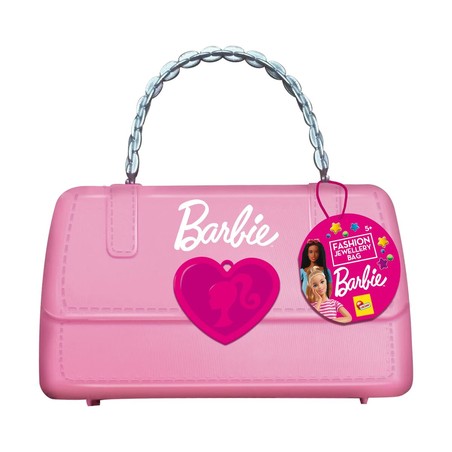 Niña sonriente mostrando sus tatuajes fáciles de aplicar de Barbie