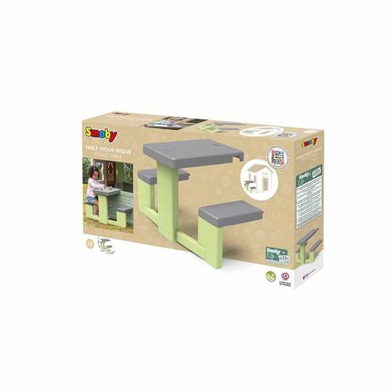 Mesa de juegos niños Smoby en jardín de casa