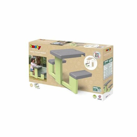 Mesa de juegos niños Smoby en jardín de casa