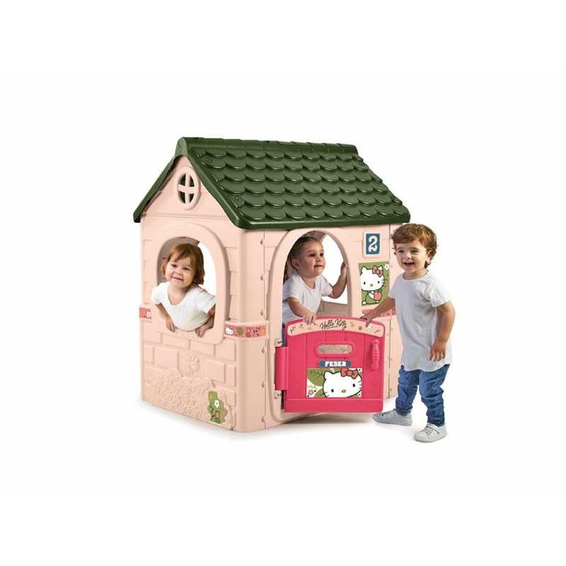 Casa de juegos infantil Hello Kitty en jardín, con niña sonriendo.