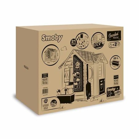 Niños jugando en la casa de juegos Smoby, fomentando el juego simbólico