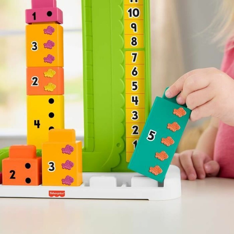 Detalle de las piezas del juego caimán infantil Fisher-Price