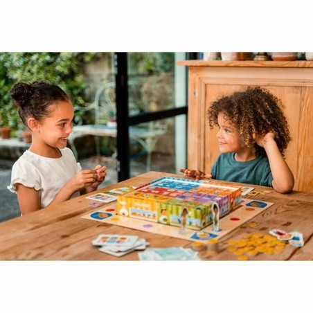 Niños jugando al juego de mesa aprender a comprar Nathan