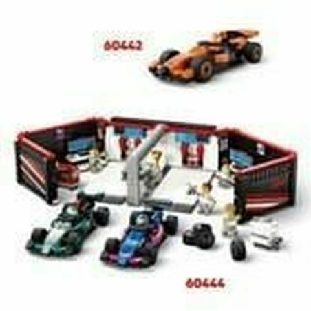 Escena de pit stop LEGO City: equipo cambiando neumáticos del Ferrari F1
