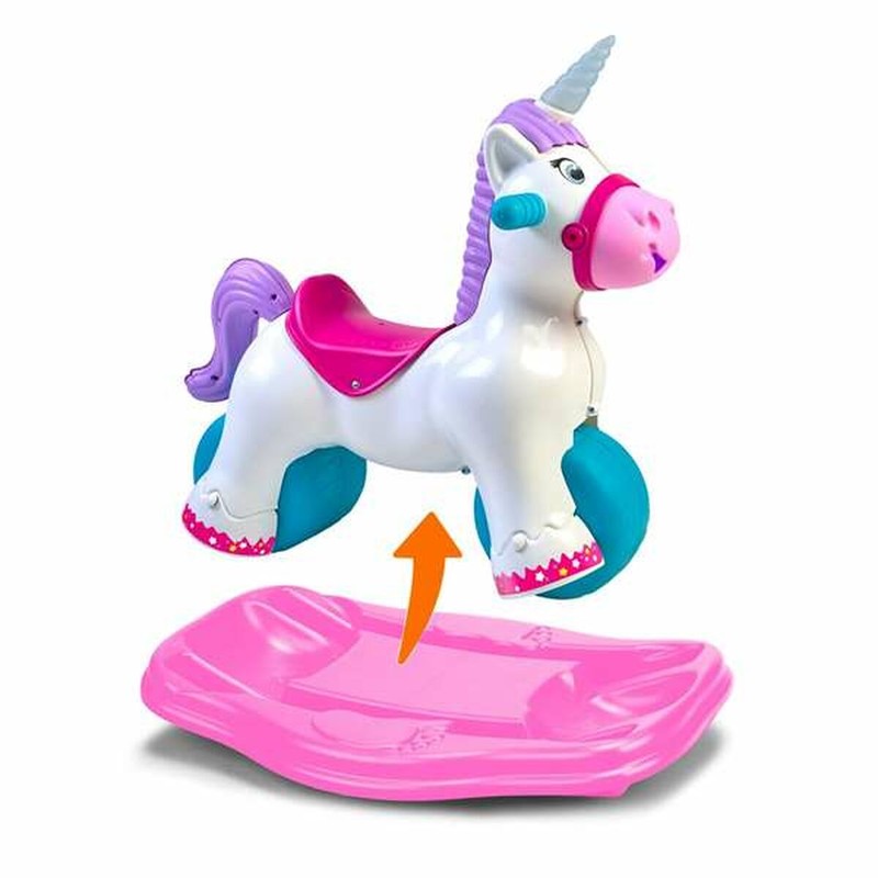 Niña feliz en balancín bebé unicornio con sonidos