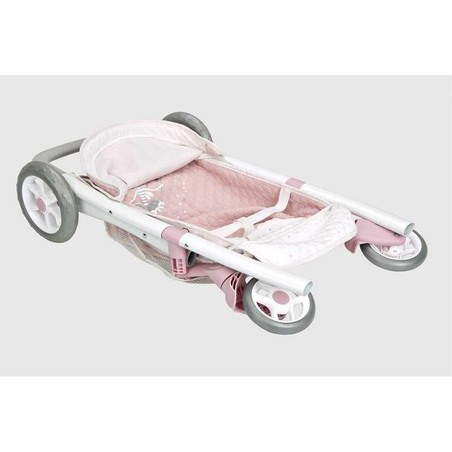 Niña paseando su carrito de muñecas Arias