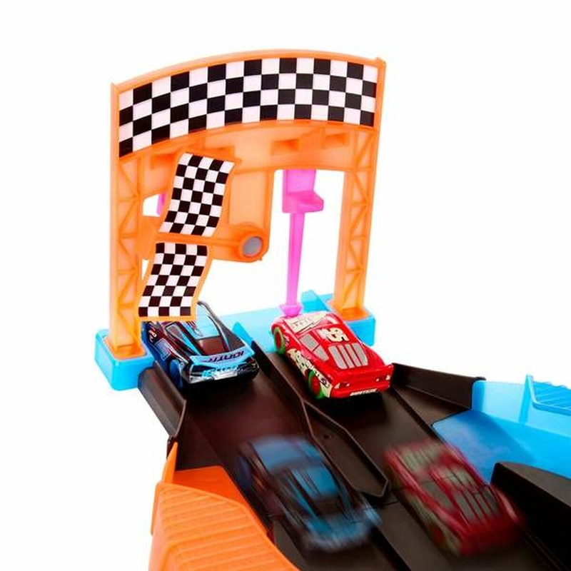 Vista de la caja del juguete Mattel Glow Racers con instrucciones multilenguaje