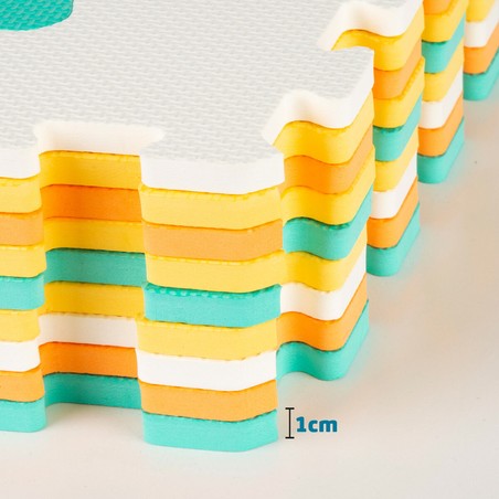 Bloques apilables bebé: Detalle de piezas de puzzle EVA con formas de vehículos.