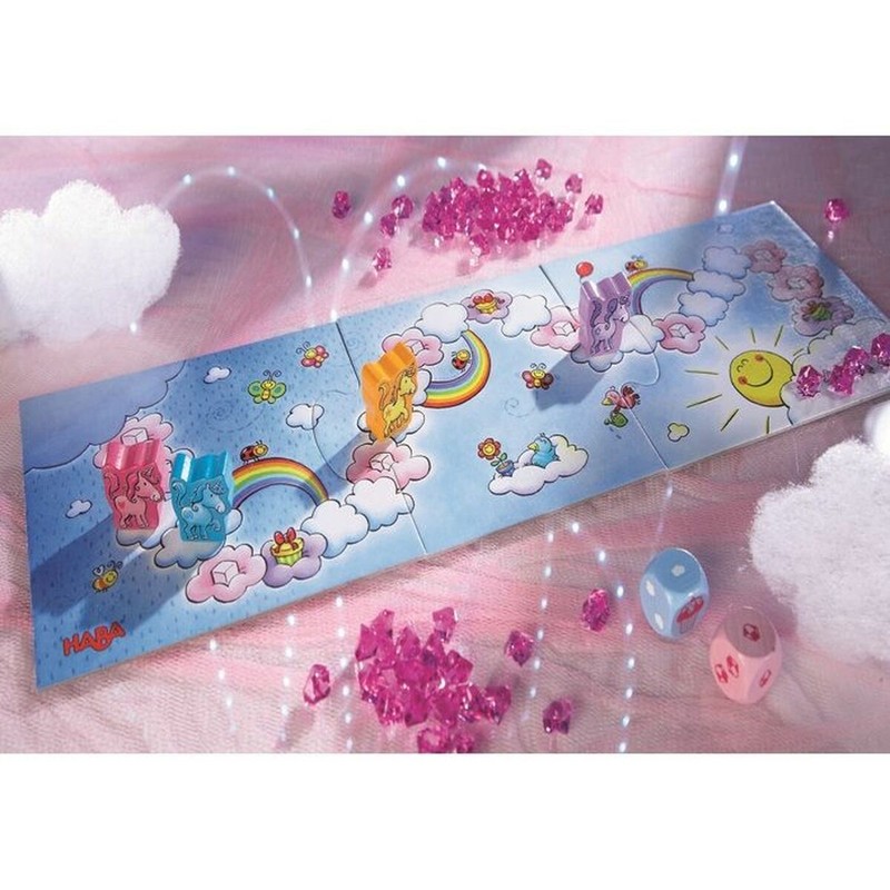 Niños jugando al juego de mesa cooperativo HABA Unicorns