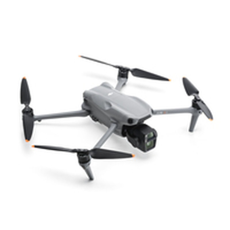 Dron plegado junto a una pista Hot Wheels imaginaria en el cielo